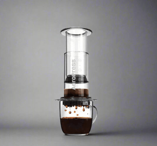 Aeropress clear dripping coffee into a mug